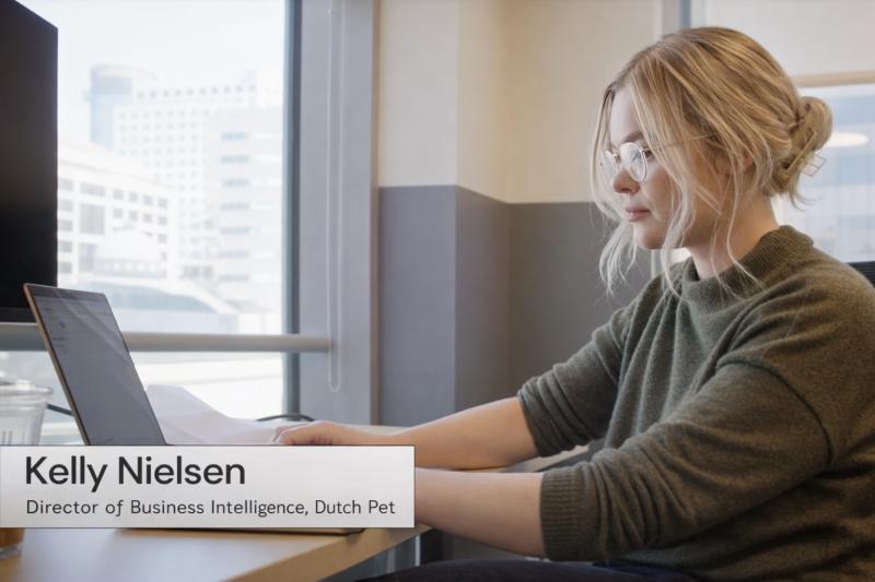 Still from Sigma's customer-story video: Kelly at her desk, captioned Director of Business Intelligence, Dutch Pet.